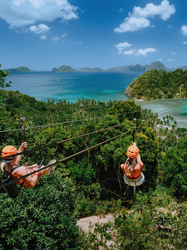 Topdeck traveler traversing the ziplines across El Nido.