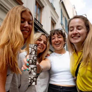 Topdeck customers taking photos together.