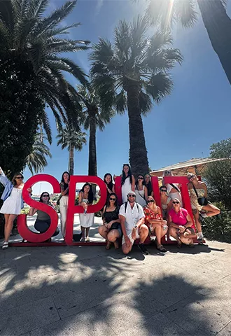 Group of people standing around large letters that spell out SPLIT in Croatia.