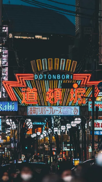 Neon signs at night of Dotonbori shopping centre in Osaka, Japan.