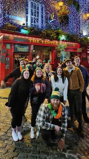 Group taking a picture outside The Temple Bar pub in Dublin, Ireland.