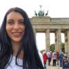 Woman with long, dark hair smiling 