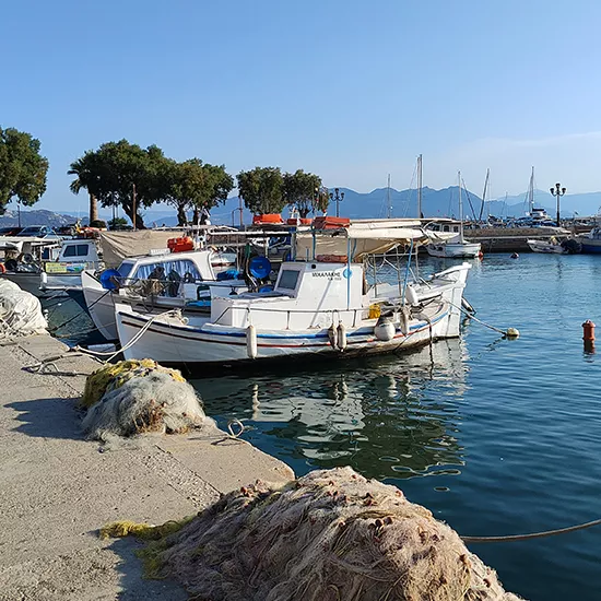 Boat docked at the port of Aegina in the Greek islands.